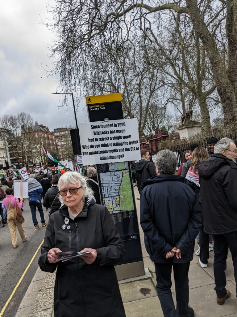 A sign at a protest for Julian Assange, claiming that WikiLeaks has a perfect record